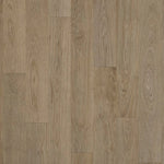 A small sample floor tile named 'Amore Brown Eik', showcasing a brown oak wood grain pattern.
